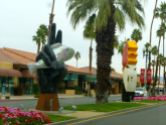 The median of El Paseo is adorned with modern sculptures.