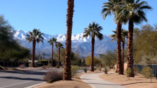 Frank Sinatra Dr in Rancho Mirage, where there are great sidewalk pathways as well as a bike lane.